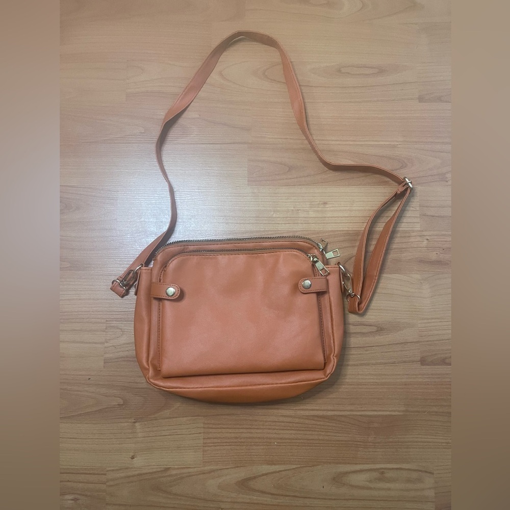 Tan Crossbody purse with multiple compartments